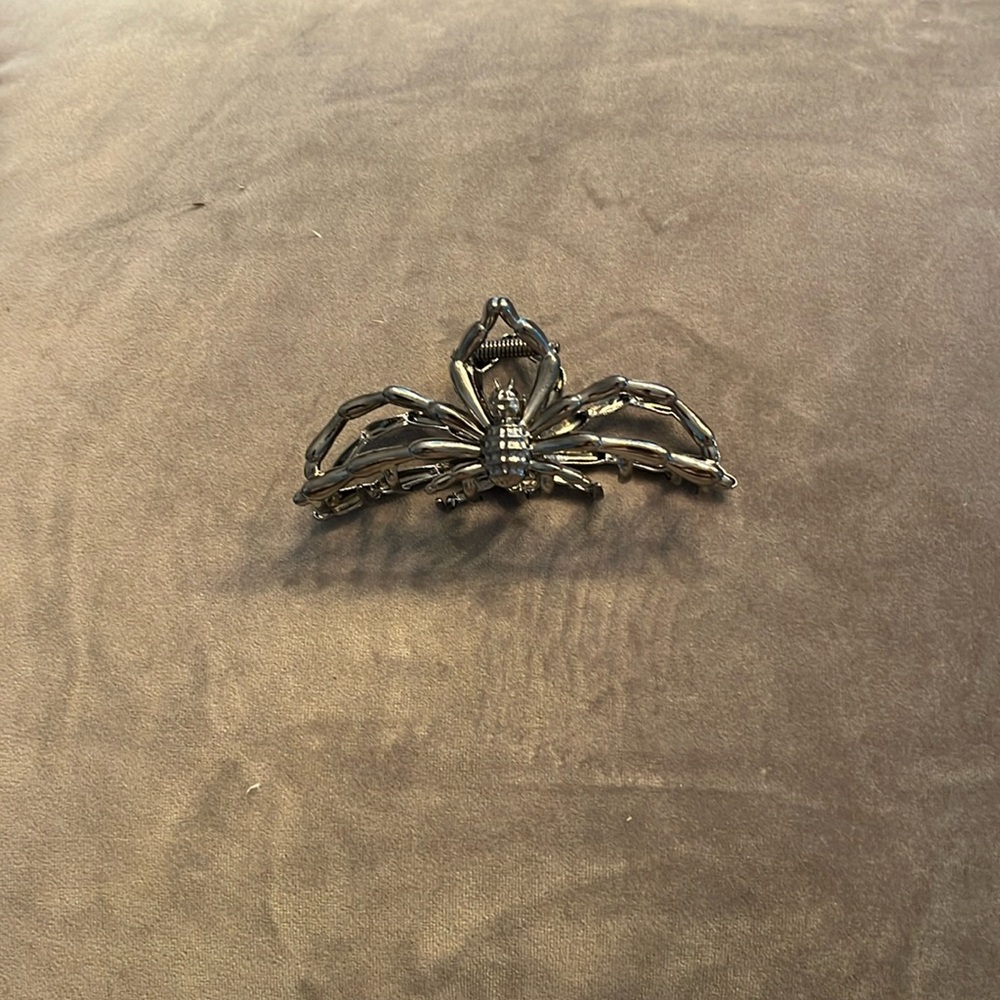 Pewter hair clip with silvery sheen.